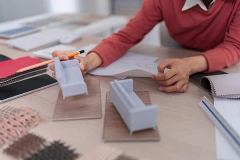 Interior designer selecting material samples fabric wood choices planning f.. Stock Photos