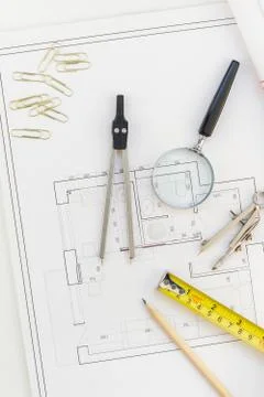 Interior designer table workplace with house plan Stock Photos