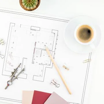 Interior designer table workplace with house plan Stock Photos