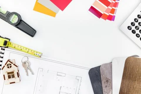 Interior designer table workplace with house plan Stock Photos