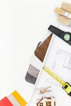 Interior designer table workplace with house plan Stock Photos