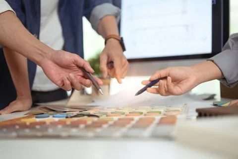 Interior designer team selecting colors for building at co working space in 写真素材