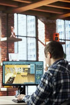 Interior designer uses architectural software on computer to help customers Stock Photos