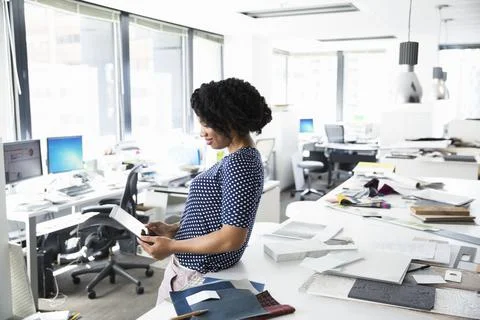 Interior designer using digital tablet in office Stock Photos