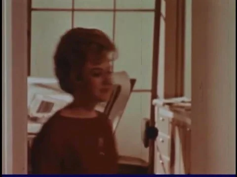 Interior designer William Pahlmann arranges furniture with hostess Vivian 스톡 동영상 74947901