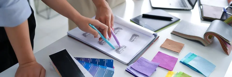 Interior Designer at Work Drawing Sofa Sketches Choosing Fabric Swatches an.. Stock Photos