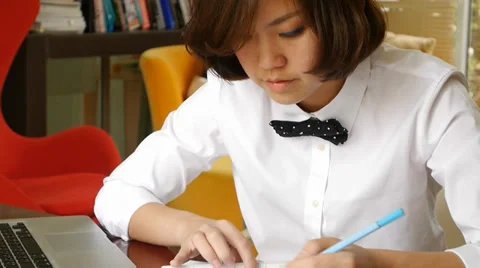 Interior designer working and typing on laptop computer Stock Footage 36239978