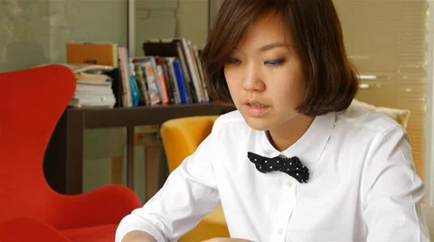 Interior designer working and typing on laptop computer Stock Footage 36240002