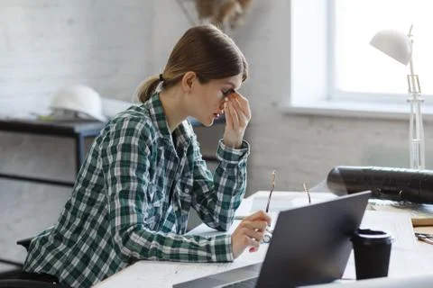 Interior designer working in office with blueprints.Engineer inspect Stock Photos