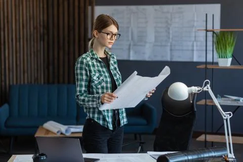 Interior designer working in office with blueprints.Engineer inspect Stock Photos