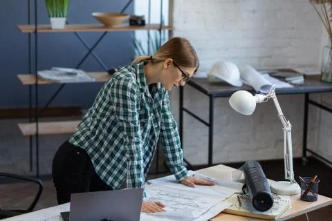 Interior designer working in office with blueprints.Engineer inspect Stock Photos