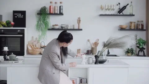 Interior designer works. A kitchen designer does design in the kitchen. Woman Stock Footage 220449266