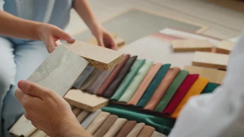 Interior designers matching material samples for home renovation project wi.. Stock Footage 334991592