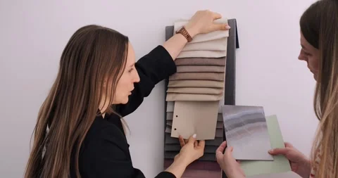 Interior designers select fabrics, paint from mood board for home renovation Stock Footage 274488354