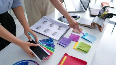 Interior Designers Selecting Fabric Samples for New Home Furnishing Project.. Stock Photos
