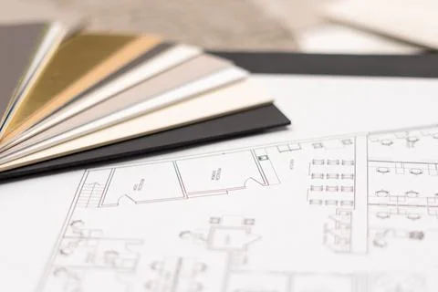 Interior designer's working table, an architectural plan of the house, a color 스톡 사진