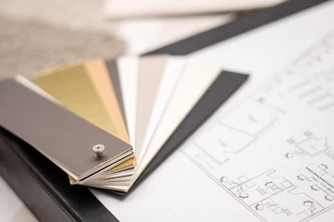 Interior designer's working table, an architectural plan of the house, a color Stock Photos