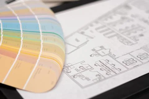 Interior designer's working table, an architectural plan of the house, a color Stock Photos