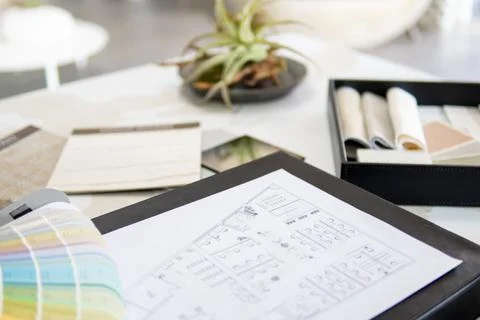 Interior designer's working table, an architectural plan of the house, a color 스톡 사진