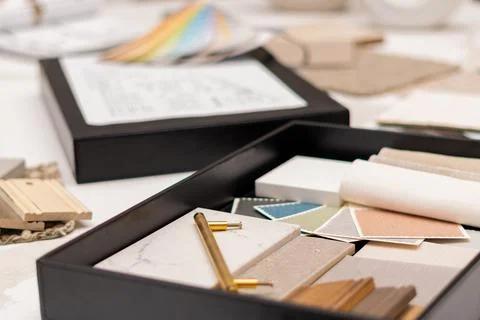 Interior designer's working table, an architectural plan of the house, a color Stock Photos
