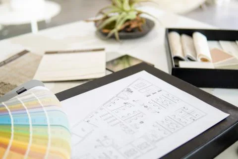 Interior designer's working table, an architectural plan of the house, a color Foto stock