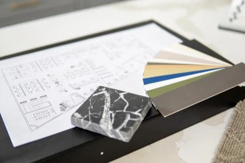 Interior designer's working table, an architectural plan of the house, a color Foto stock