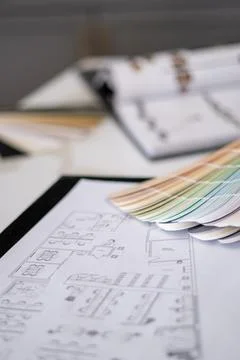 Interior designer's working table, an architectural plan of the house, a color 스톡 사진
