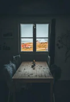 Interior with dining table and arctic landscape with icebergs with sunlight and Stock Photos