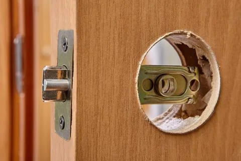 Interior door lock latch at the installation stage. Stock Photos