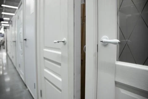 Interior doors installed in a row. different doors in the hardware store Stock Photos