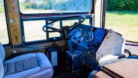 Interior of the driver's compartment featuring the steering wheel and contr.. Stock Photos