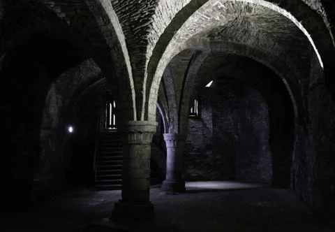 Interior of dungeon in ancient castle, construction and architecture Stock Photos