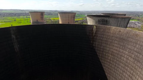 Interior edge cooling tower with strong shadow gradient, curved concrete wall Stock Footage 334324129