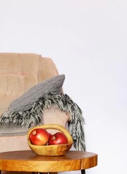 Interior elements - chair, blanket, coffee table and red apples Stock Photos