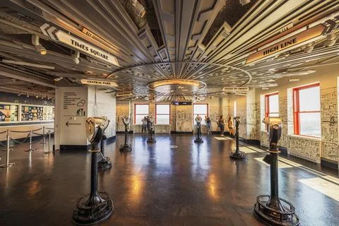 Interior of Empire State Building observatory with viewfinders and visitors Stock Photos