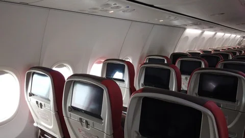 Interior of Empty Boeing 737 Passengers Airplane. Cabin with Rows of Seats. Stock Footage 129949179