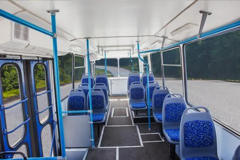 Interior of an empty bus moving on a country highway Stock Photos