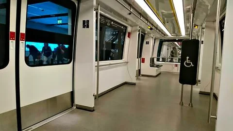 Interior of an empty carriage of subway or train connecting terminals in Munich Stock Photos