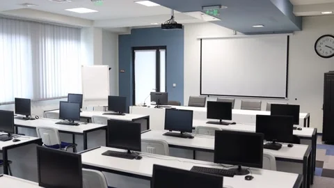 Interior of empty classroom with desks and chairs. Video stock 231140086