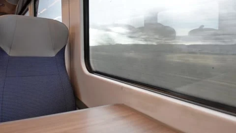 Interior of an empty commuter train carriage moving Stock Footage 194727821