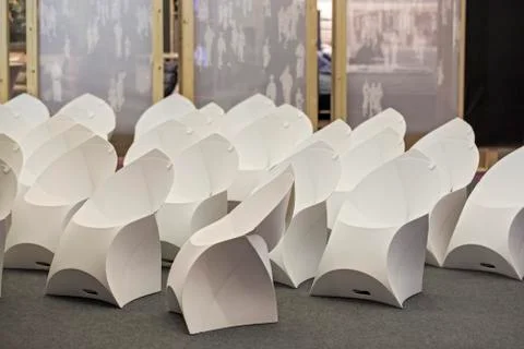 Interior of empty contemporary conference hall with white modern chairs. Stock Photos