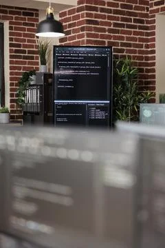 Interior of empty data center office with multiple computer screens showing Foto stock