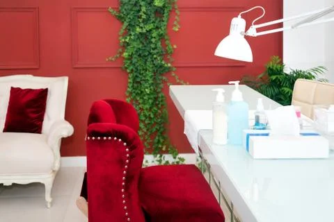 Interior of empty modern nail and beauty salon. Long table with lamp, manicur Stock Photos