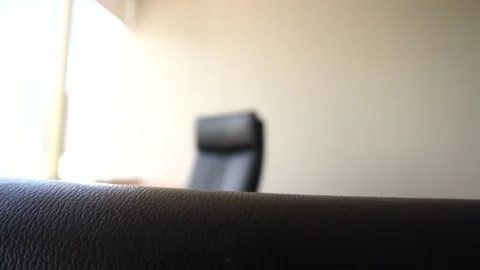 Interior of empty modern office desk space with a black chair Stock Footage 147958919