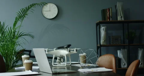 Interior of the empty modern office room with a laptop computer on the table Stock Footage 104976946