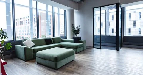 Interior of empty modern office with sofa and windows Fotos de archivo