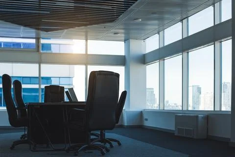 The interior of an empty modern office with a table and chairs and a meeting Stock Photos