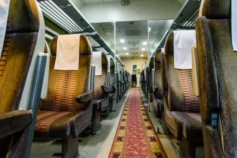 Interior of the empty railroad car with comfortable seats Foto stock