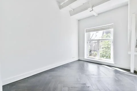 Interior of empty room with white walls Stock Photos