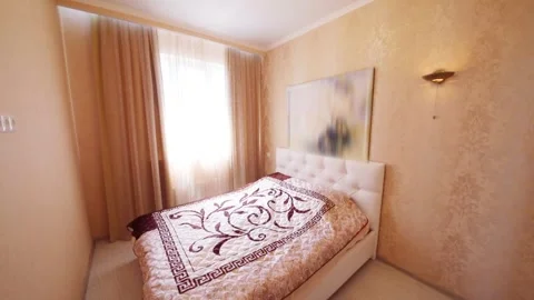 Interior of empty simple cozy bedroom with double bed Stock Footage 276359035